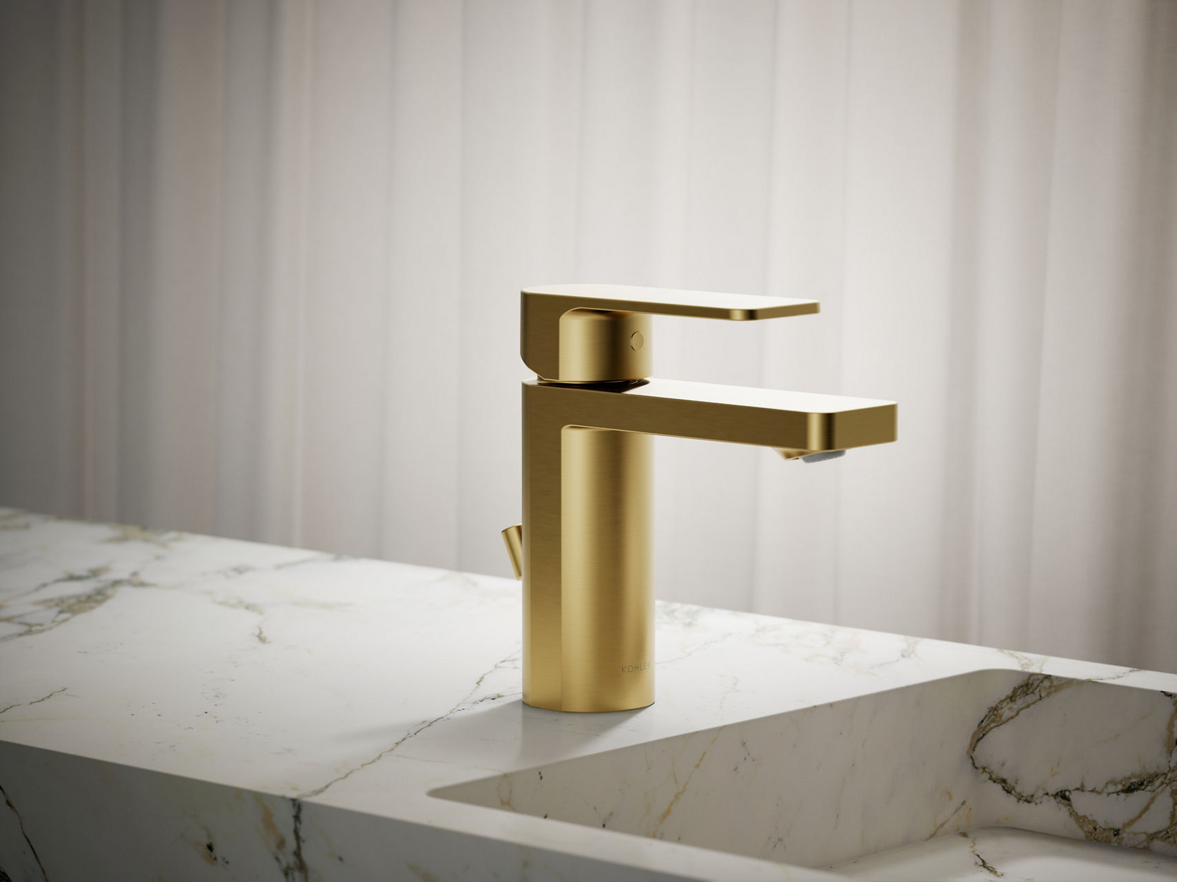 Contemporary single-handle brushed gold faucet with sleek rectangular spout on white vanity.