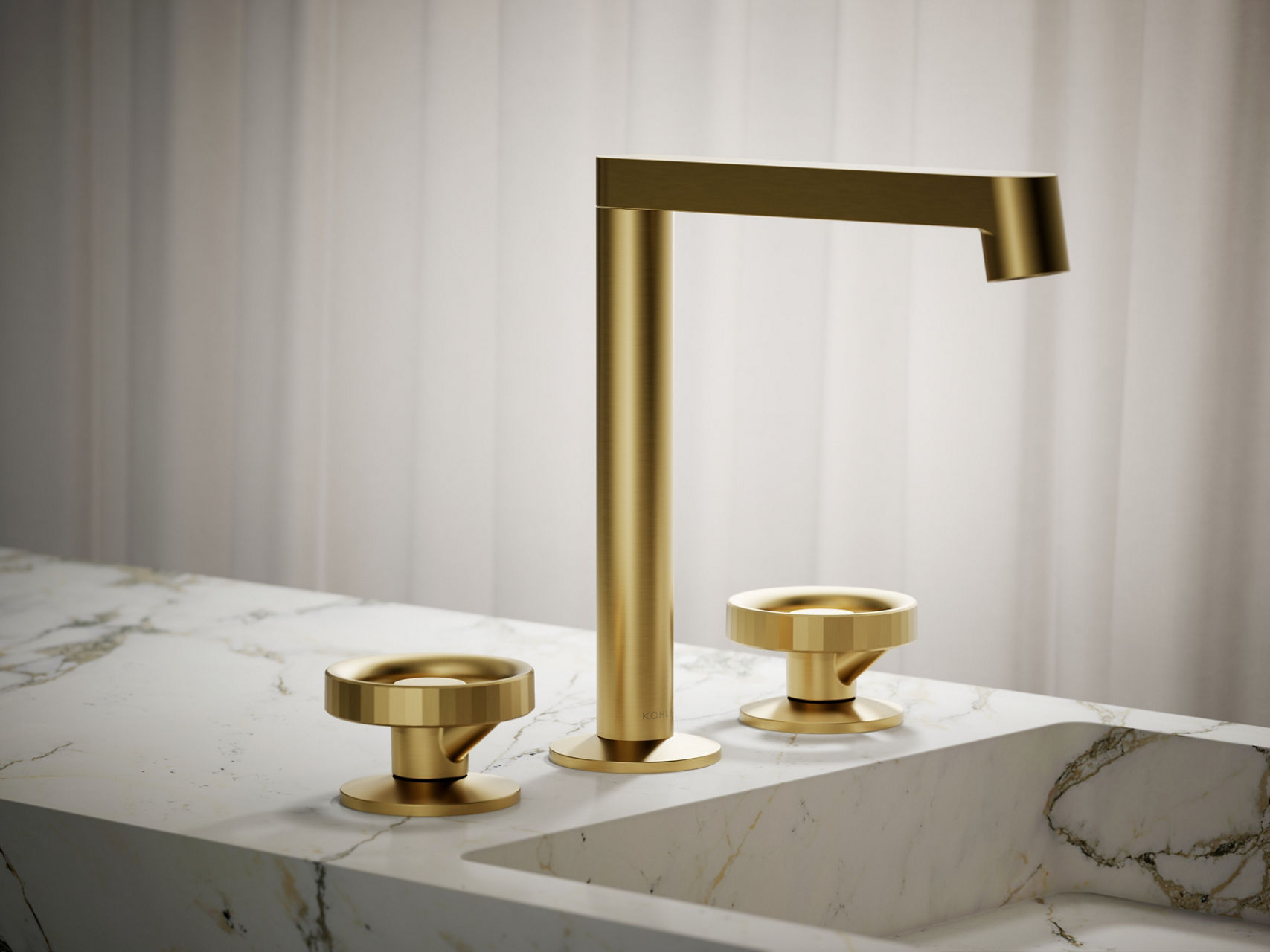 Minimalist brushed gold faucet with flat rectangular spout and matching cup detail on marble vanity.