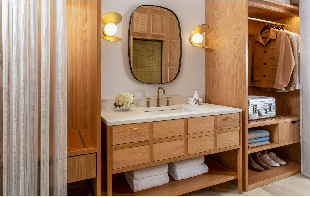 Guest bathrooms at the Virgin Hotels Edinburgh feature KOHLER® Kathryn™ undermount bathroom sinks paired with Purist faucets.
