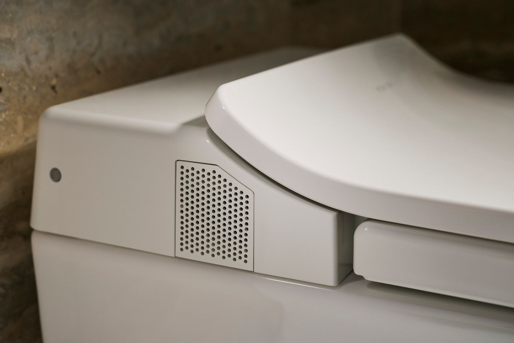 Close-up of a smart toilet with an integrated deodorizer