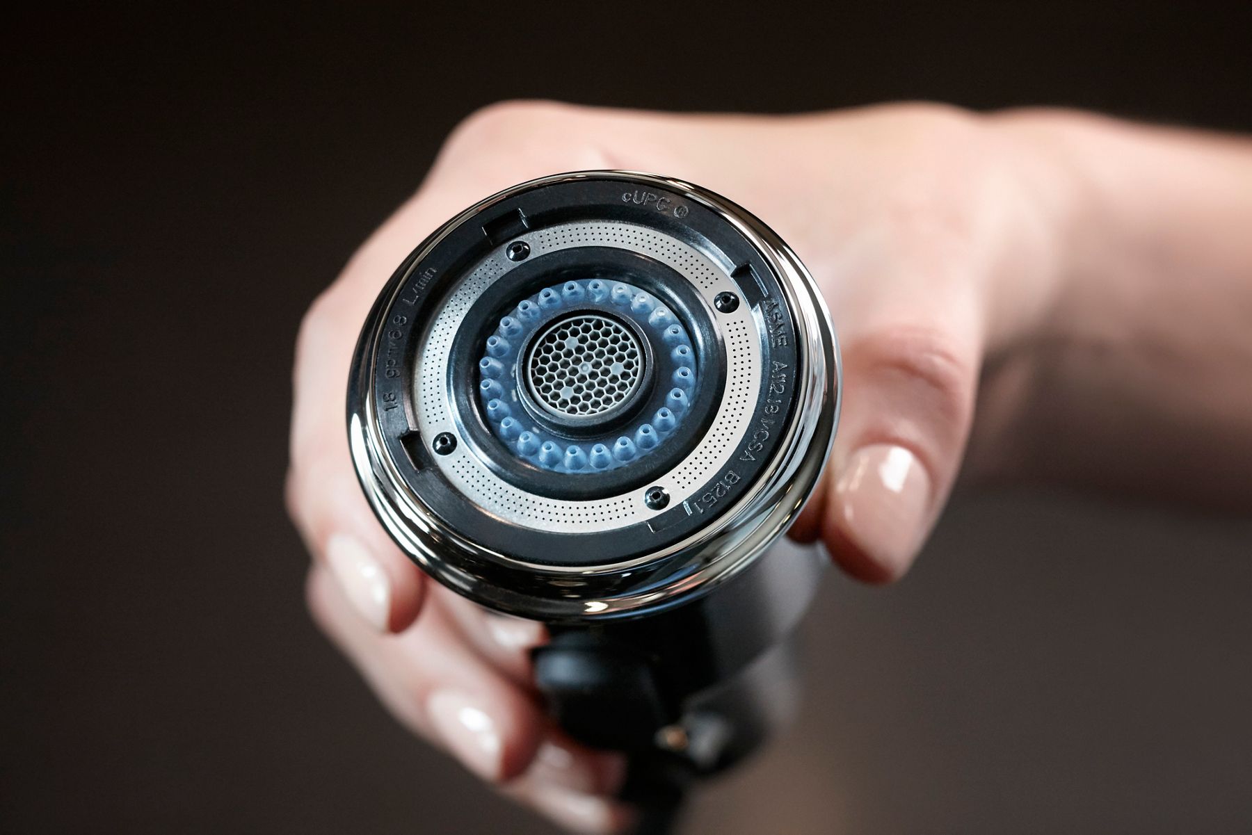 Close-up of a Kohler pull-down kitchen faucet spray nozzle, showing the details of the part.