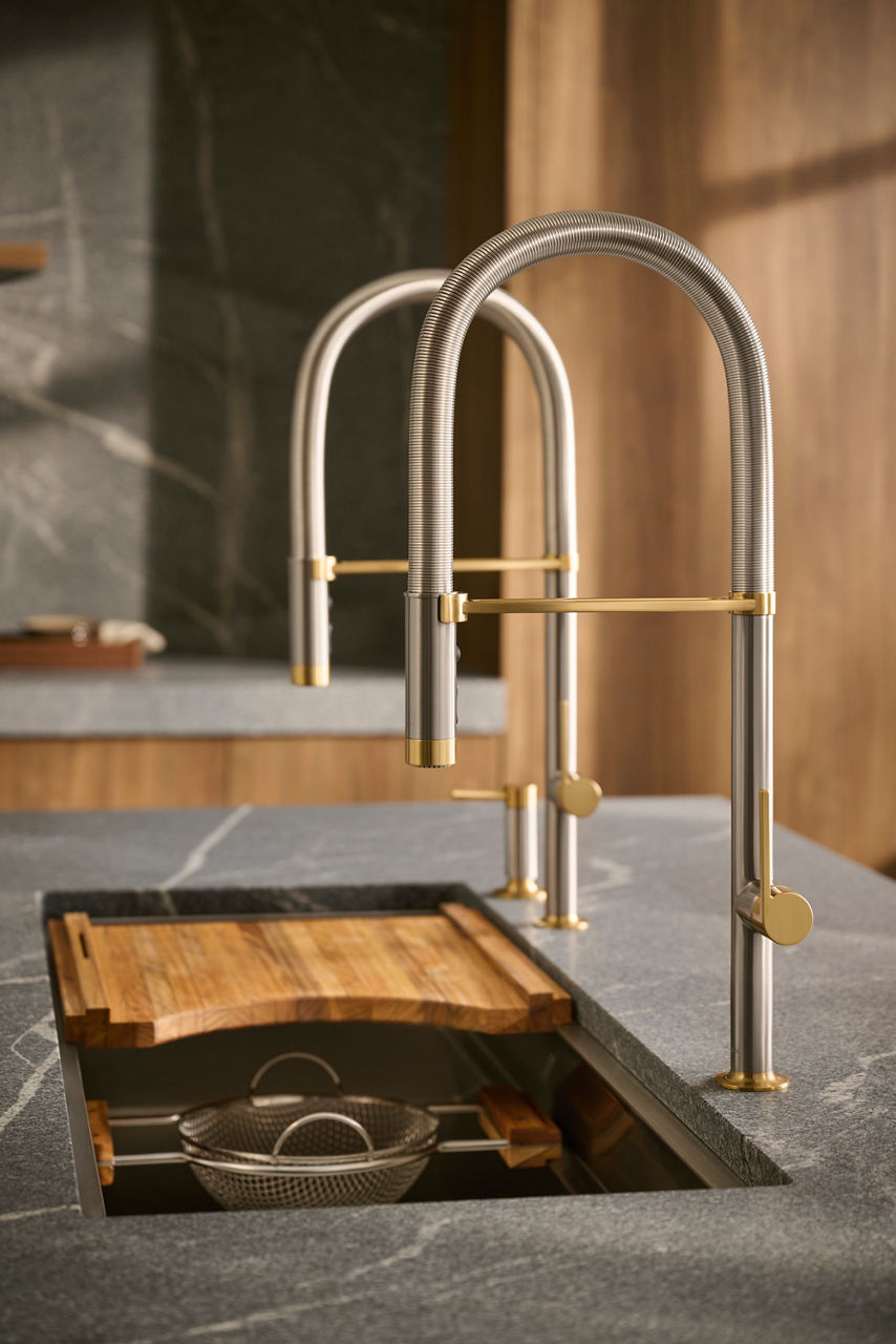Kitchen faucet and sink with mixed material fixture details