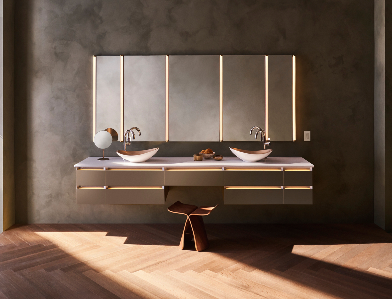 Floating double vanity with lit drawer edges and vessel sinks below five mirror panels