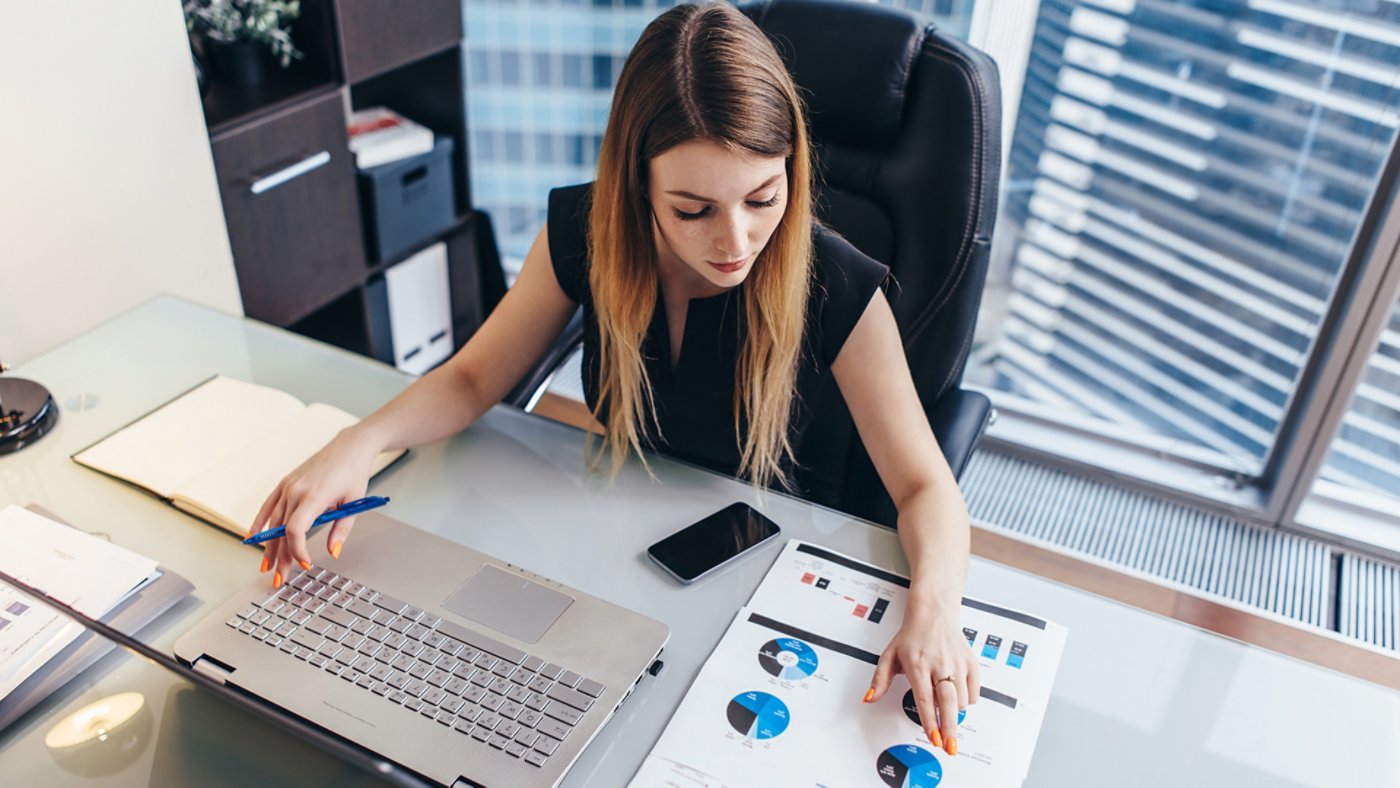 Woman working with financial stats
