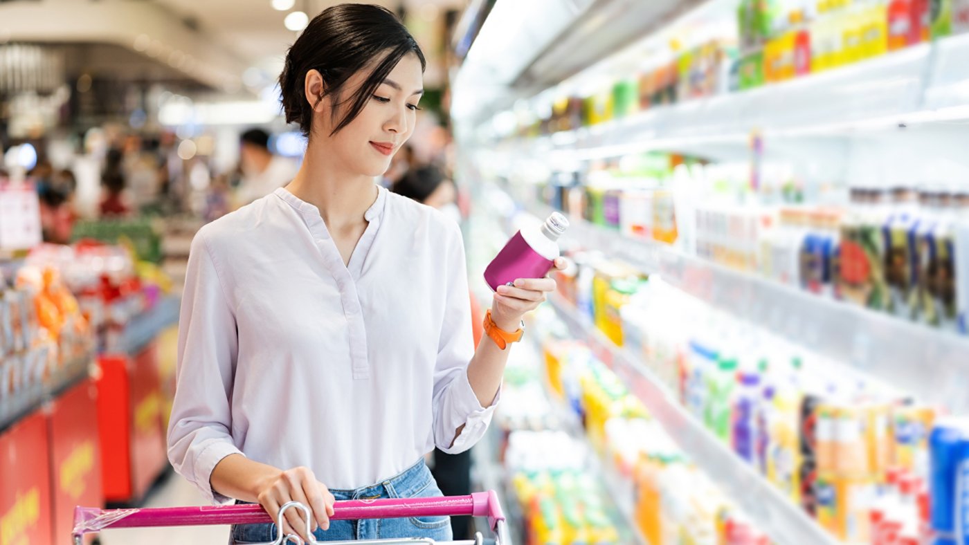 Asian woman going to the supermarket to buy supplies