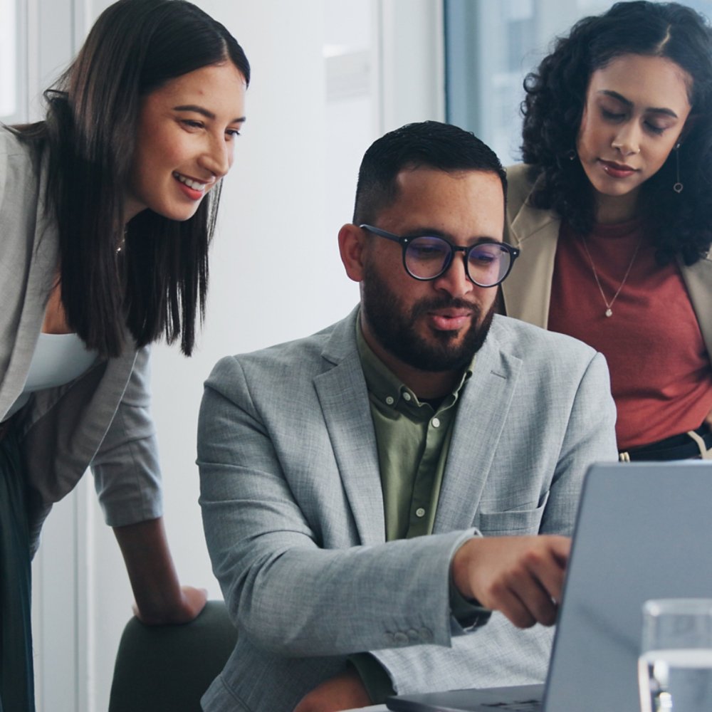 Three people working on a business project - 21x9 version