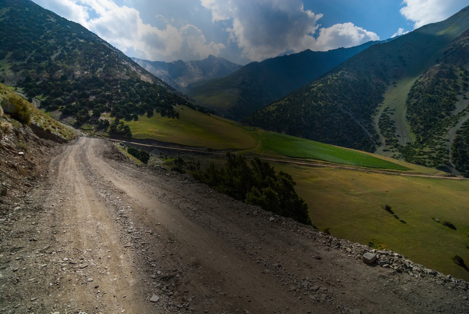 Steep and winding serpentine unpaved road to the mountain pass