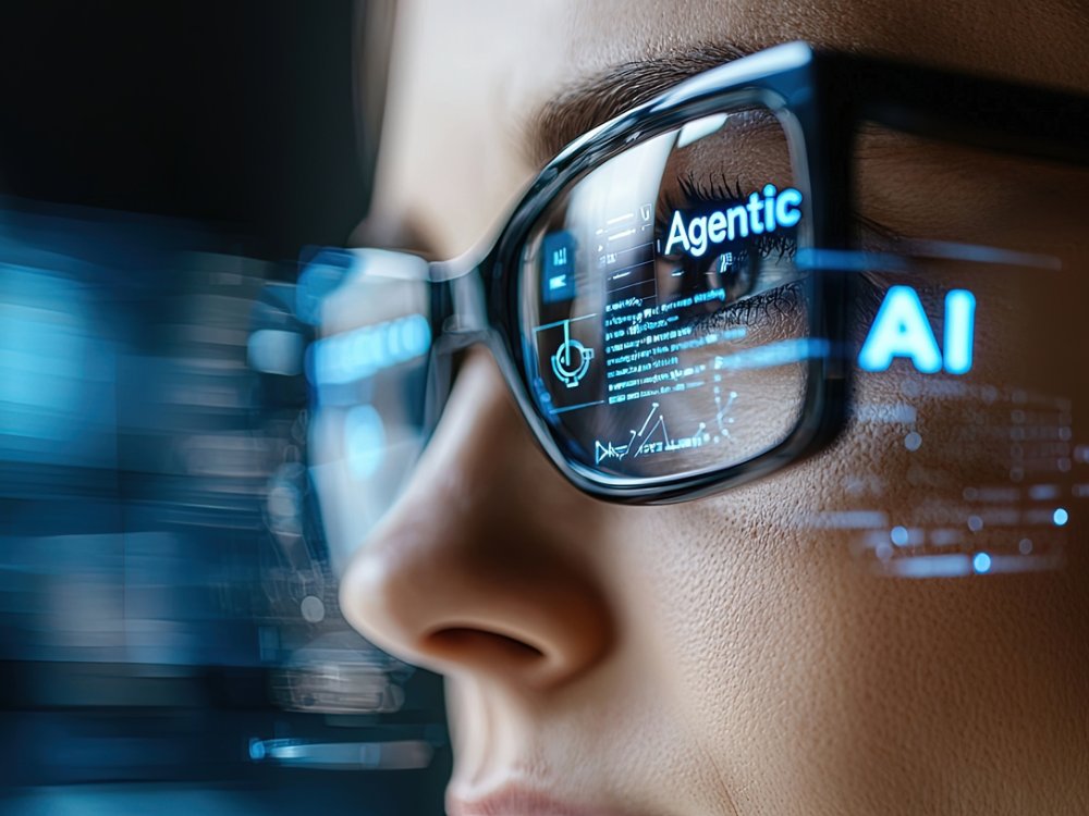A focused businesswoman analyzes data using an AI assistant through smart glasses, showcasing technology integration in a modern professional environment.