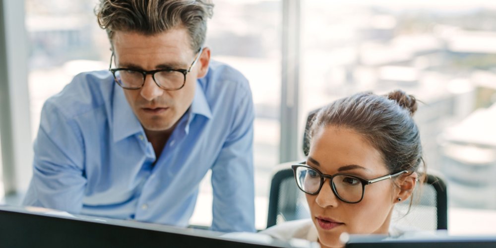 Focused business team using a computer in office