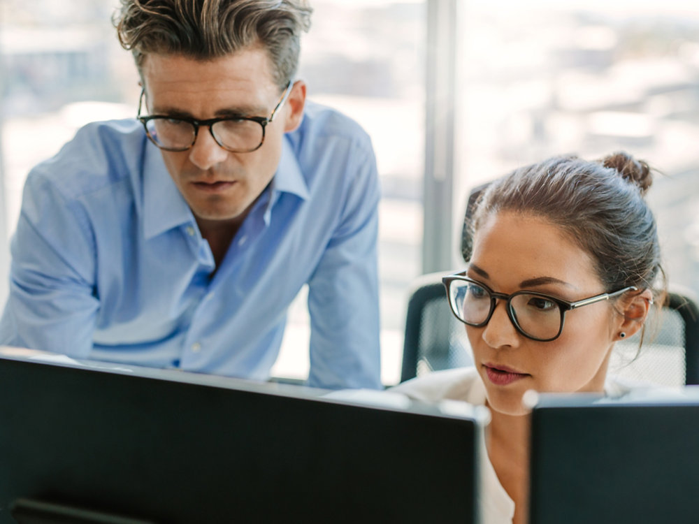 Focused business team using a computer in office