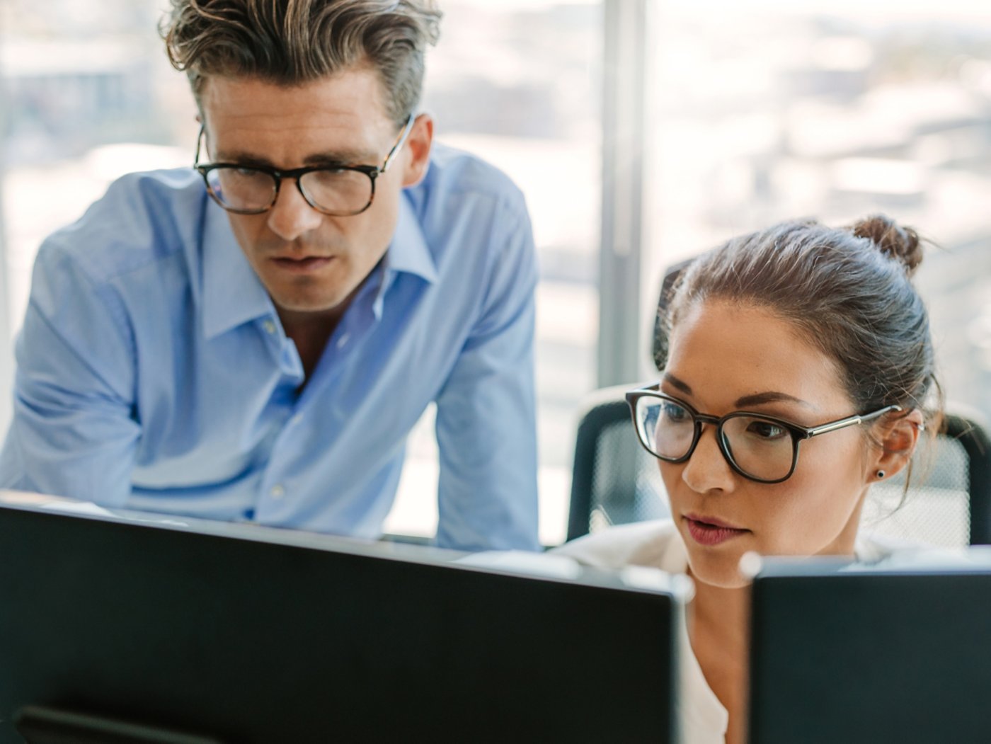 Focused business team using a computer in office