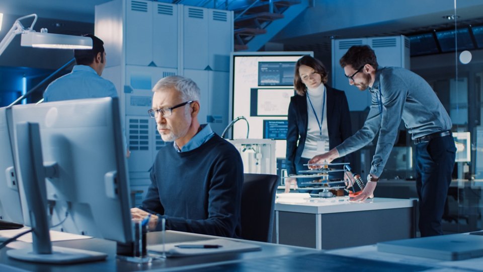 Diverse International Team of Industrial Engineers and Scientists Working in Research Laboratory and Development Center. People Working with 3D Printing, Using Computers, Designing Hardware