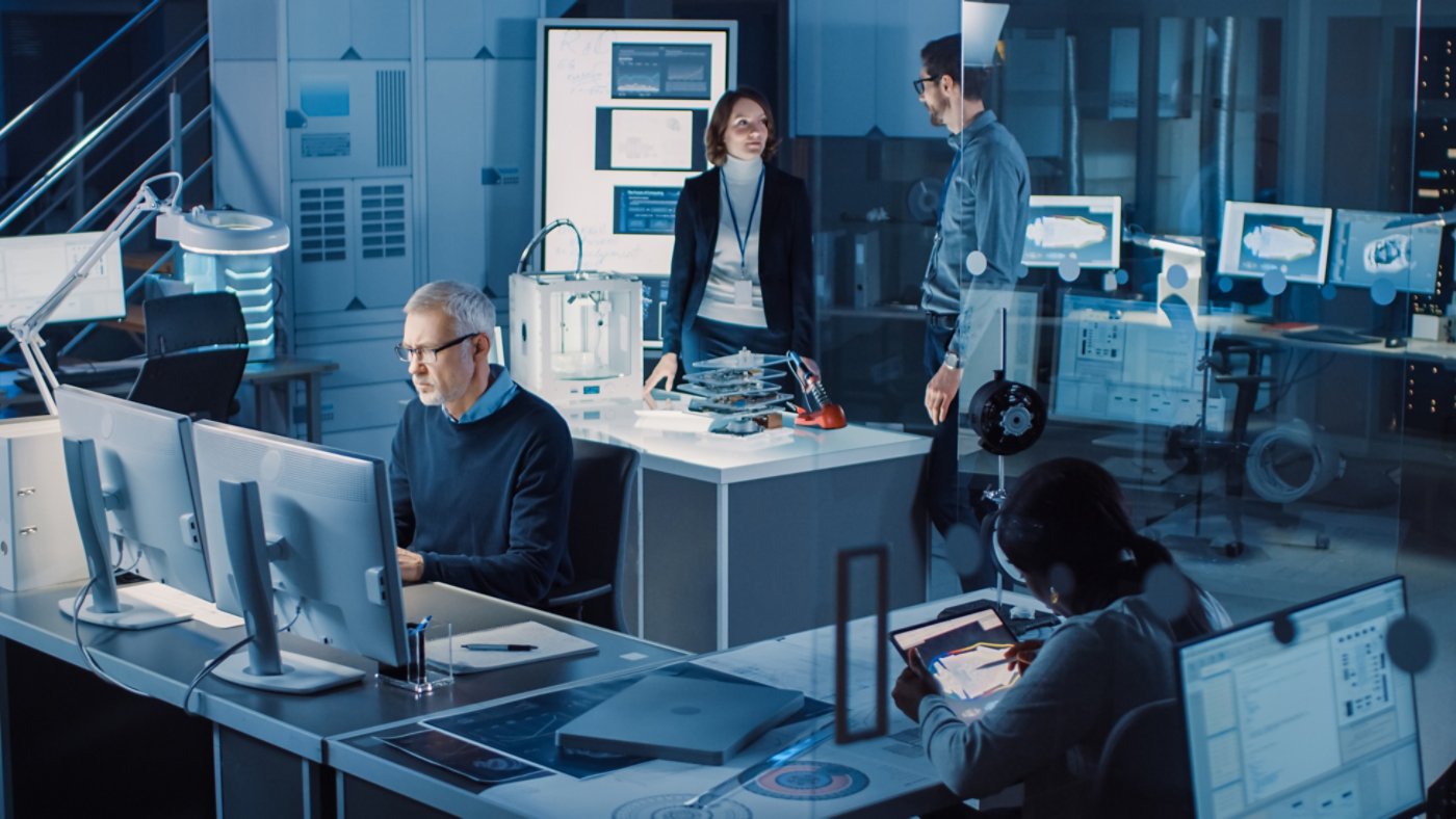 Diverse International Team of Industrial Engineers and Scientists Working in Research Laboratory / Development Center. People Working on Efficient Engine Design, Using Computers, Advanced Technology