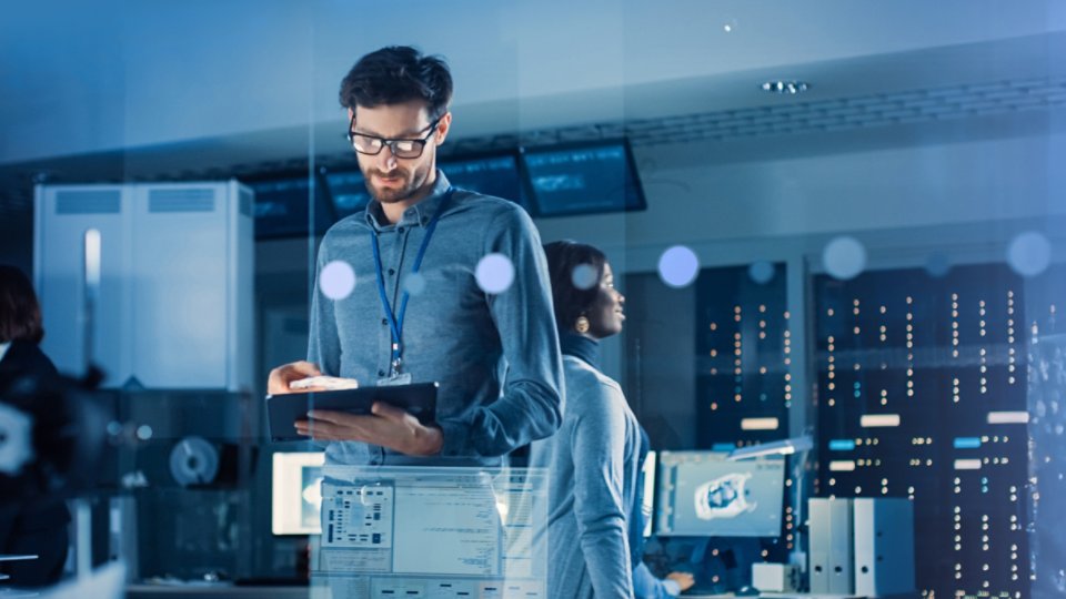 People working in a data server room
