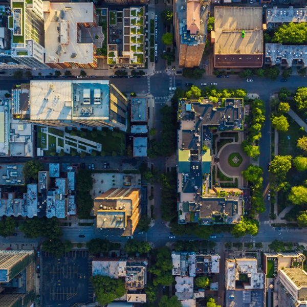 Top down aerial view of downtown urban grid with park