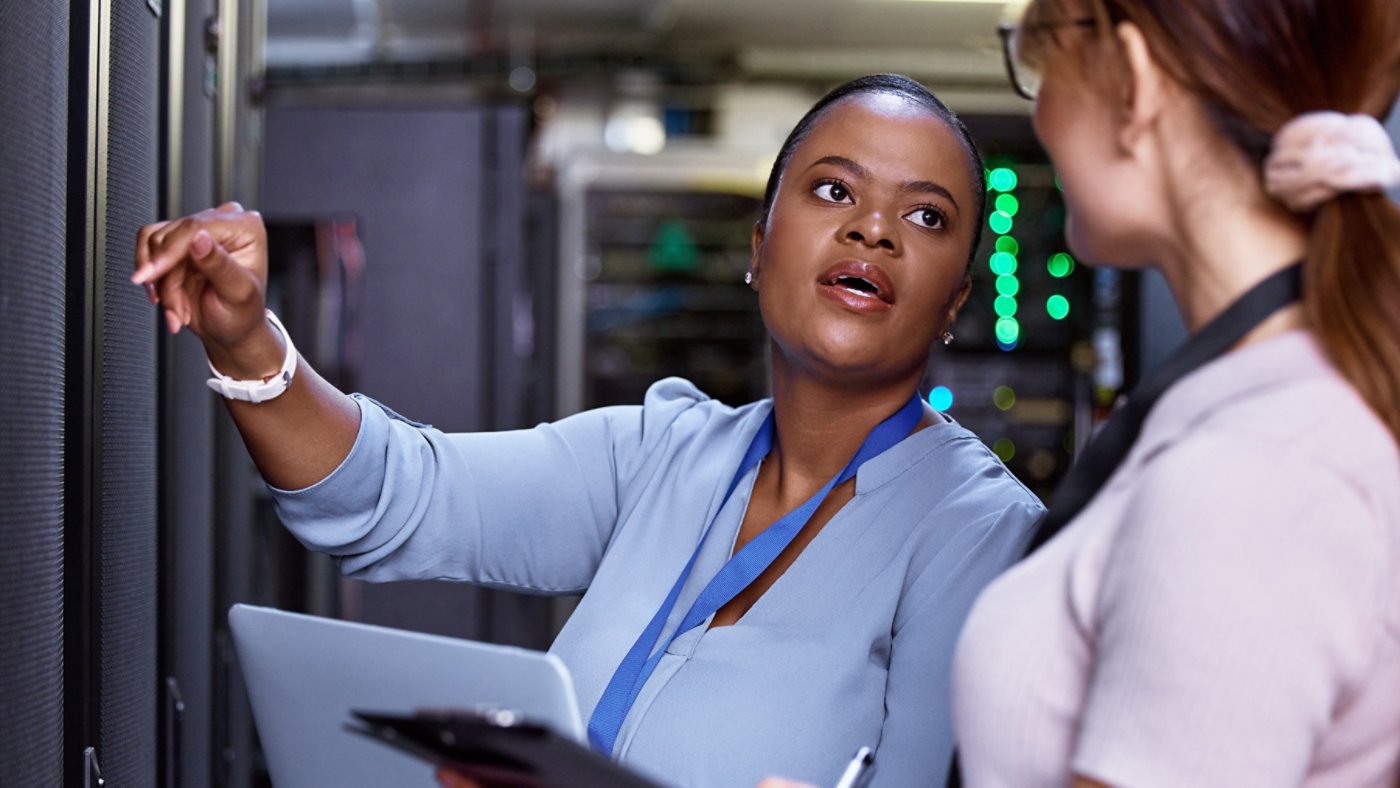 We need these servers running at optimum efficiency. Cropped shot of two attractive young female computer programmers working together in a server room.
