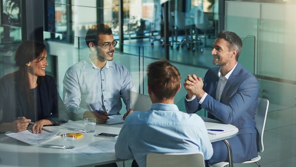 Business people, meeting and discussion for corporate planning, strategy or brainstorming at the office. Group of employee workers in business meeting, team planning or collaboration at the workplace