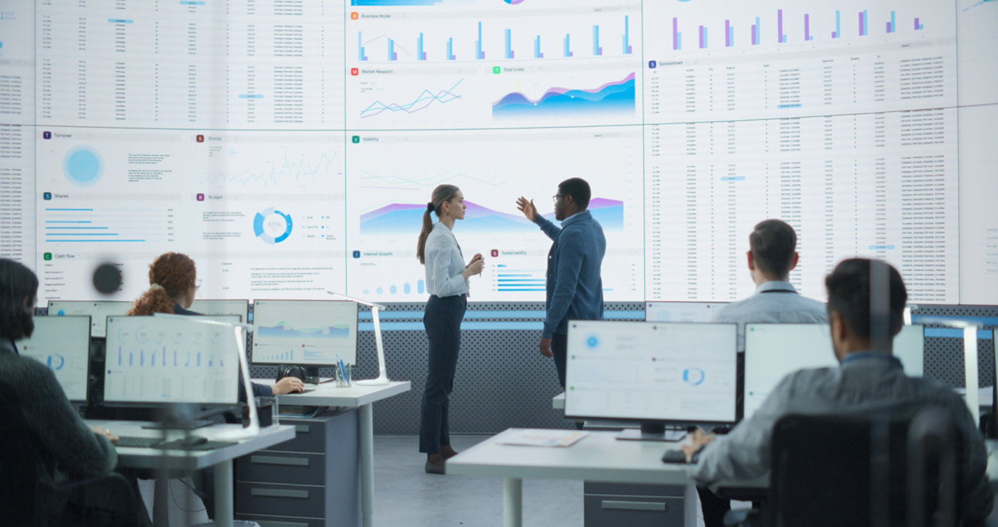 employees discussing data analytics of their company