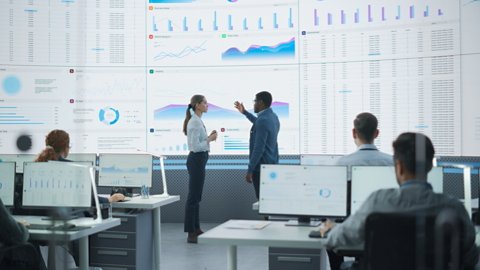 employees discussing data analytics of their company