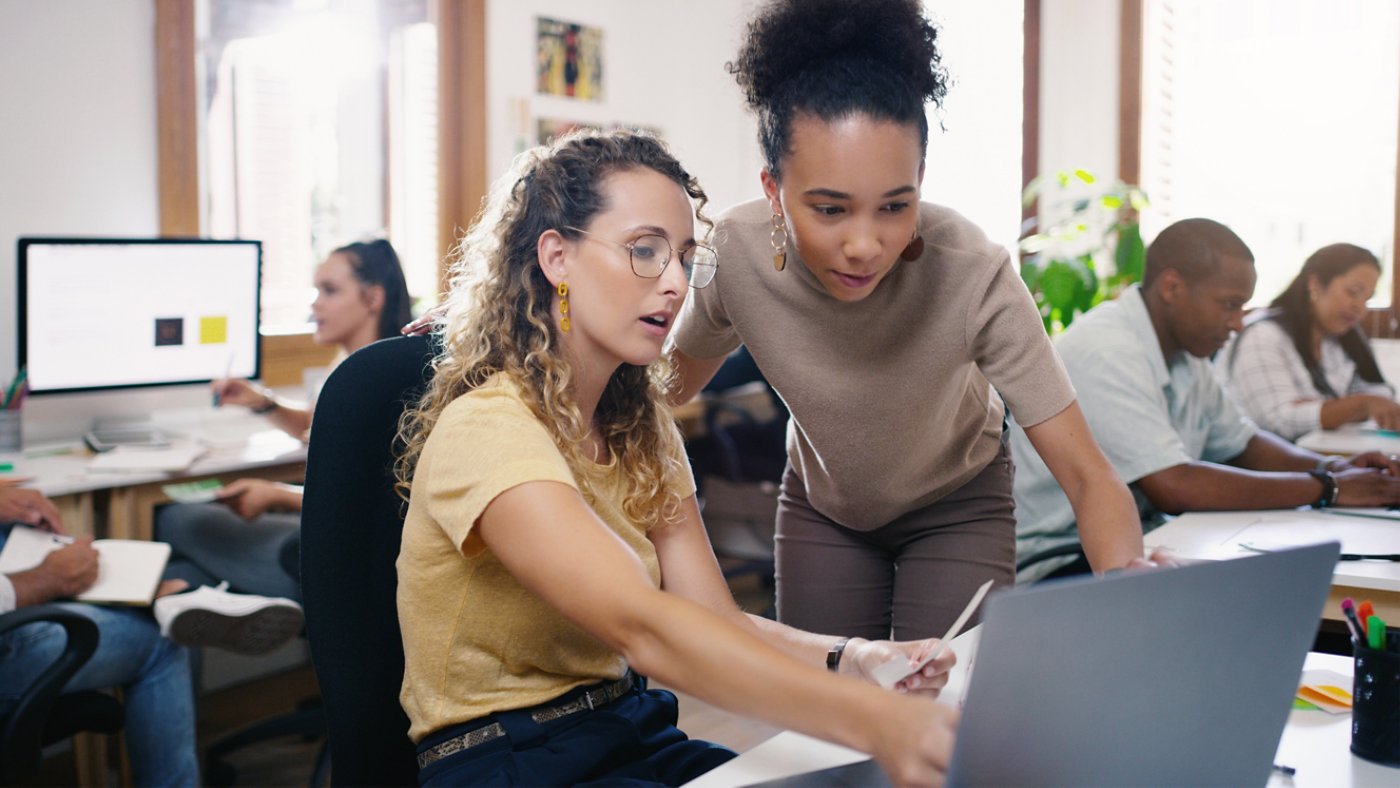 Talking, planning and business people in training with a laptop for leadership and mentoring. Meeting, project management and women speaking about online strategy, ideas or inspiration at work