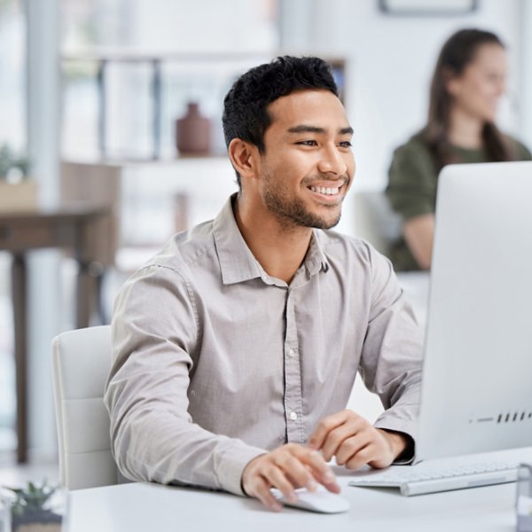 Business, smile and man with a computer, connection and administrator with digital planning, search internet and website information. Male person, employee and consultant with a pc and online reading.