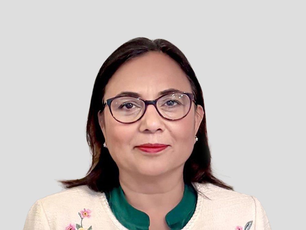 Woman in embroidered white jacket