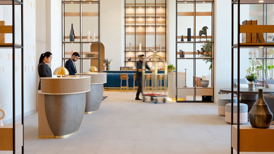 Modern hotel lobby with reception desks