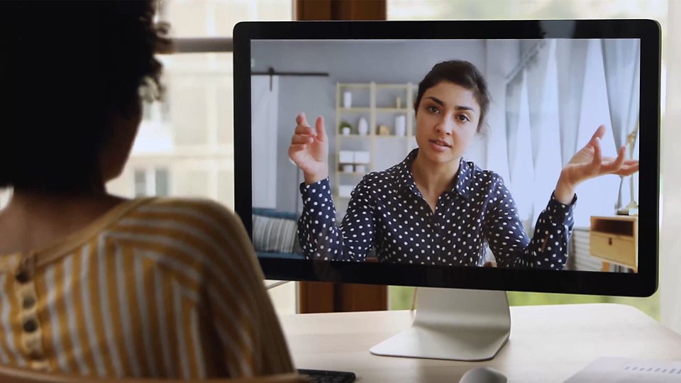 A still image of two women on a video call, advancing digital equality and inclusion