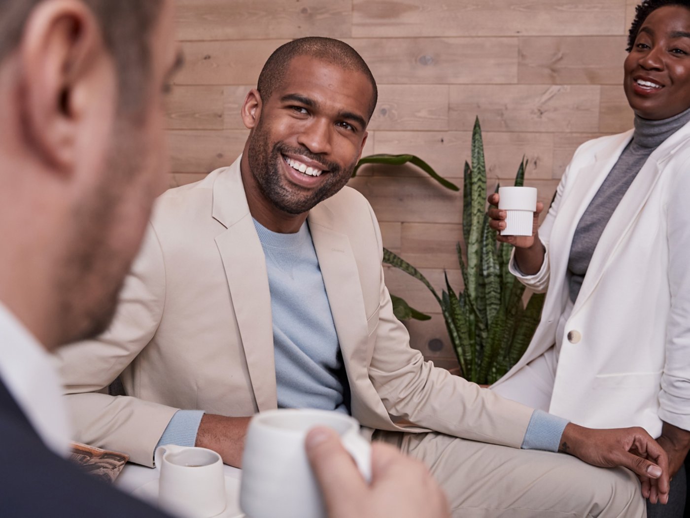 Business casual people talking over a coffee