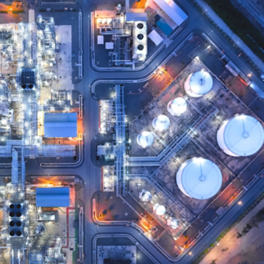 Large industrial estates of oil and gas refinery, Aerial view of industry plants, oil storage tanks and pipeline at night