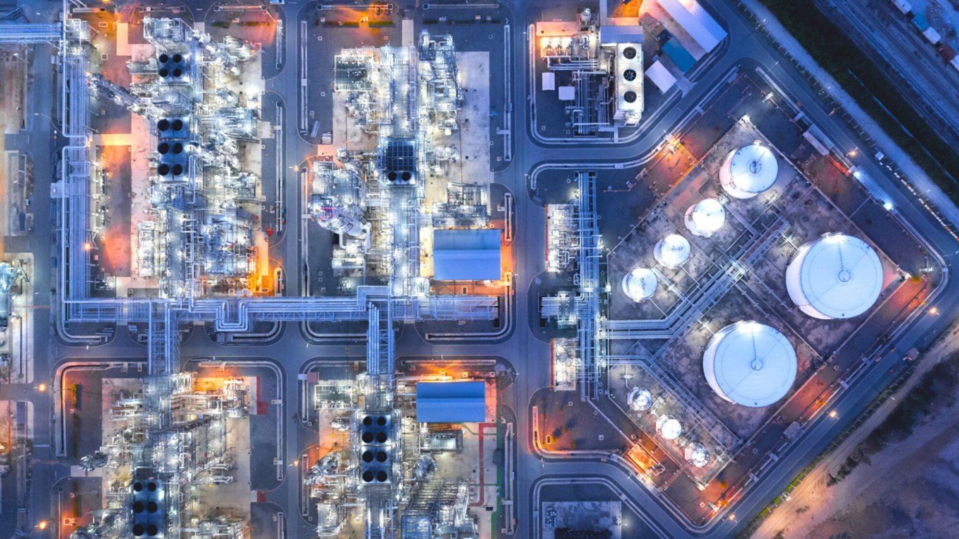 Large industrial estates of oil and gas refinery, Aerial view of industry plants, oil storage tanks and pipeline at night
