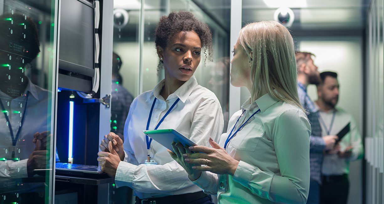 Women technicians discussing network problems