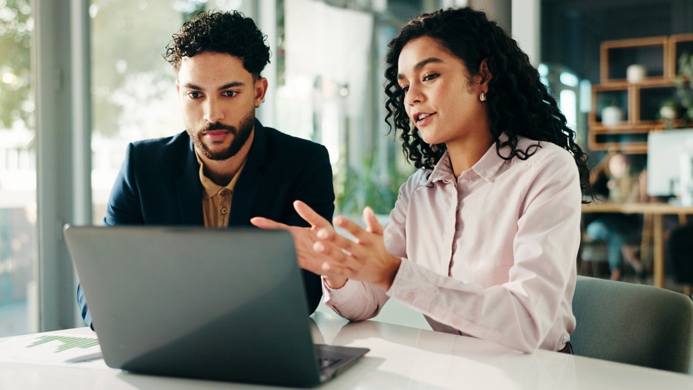 People, talk and meeting with laptop in office for finance report, ideas and investment pitch. Staff, explain and document with team for profit growth, revenue and chart results of financial proposal.