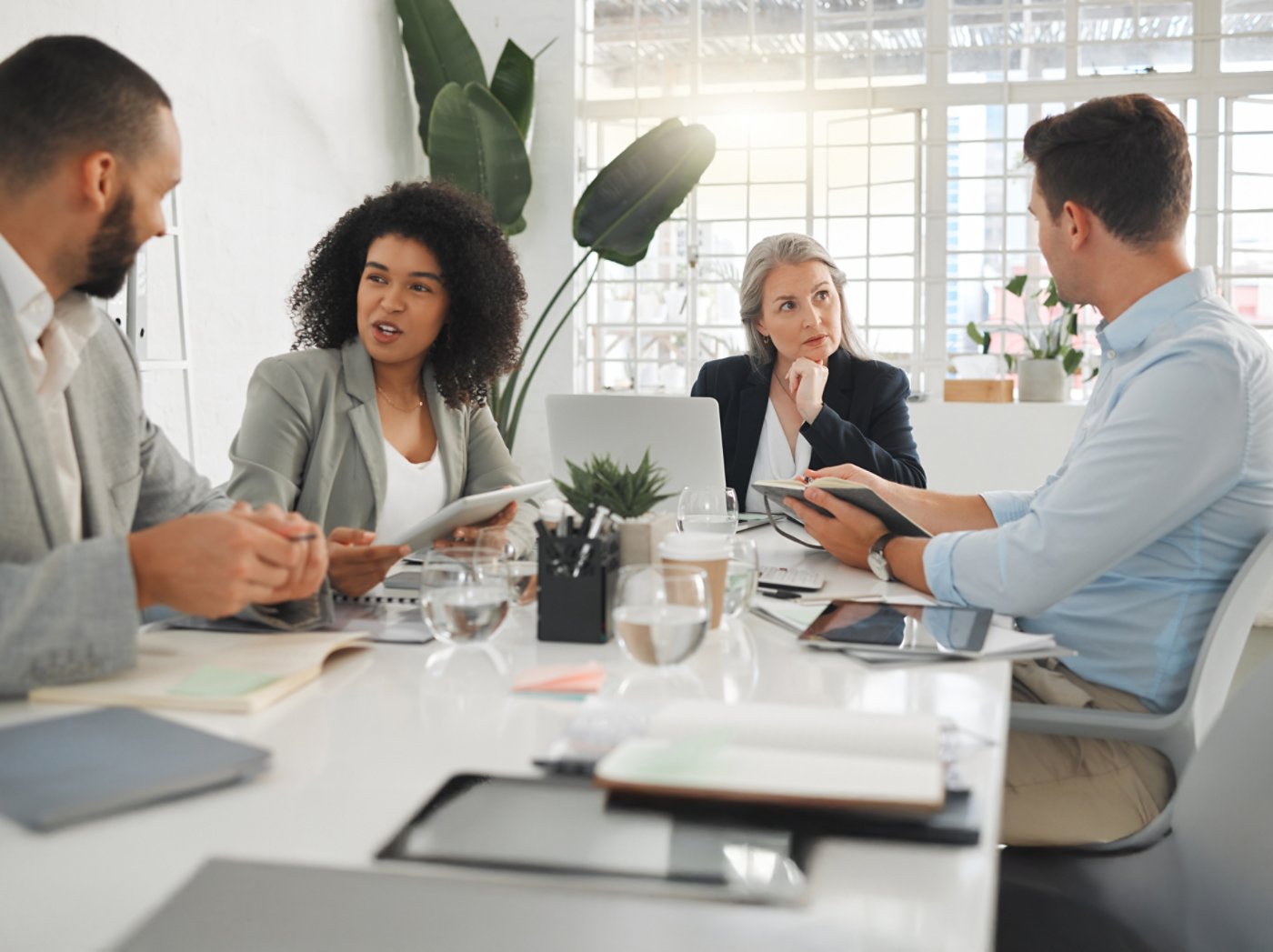 Office, teamwork and business people with discussion in meeting, planning and case review in law firm. Employees, lawyers and mentor with listening for justice updates, corporate project and ideas