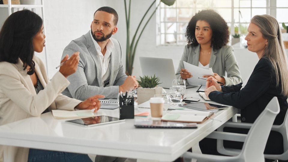 Office, collaboration and business people with discussion in meeting, planning and case review in law firm. Employees, lawyers and team with listening for justice updates, corporate project and ideas.