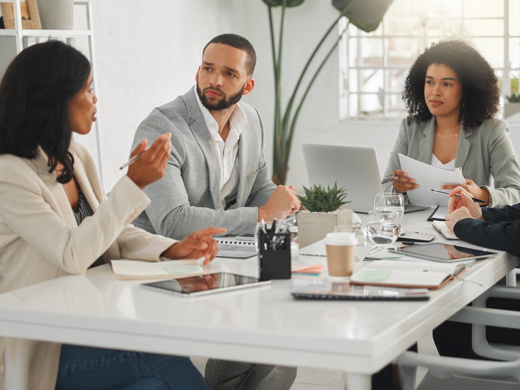 Office, collaboration and business people with discussion in meeting, planning and case review in law firm. Employees, lawyers and team with listening for justice updates, corporate project and ideas.