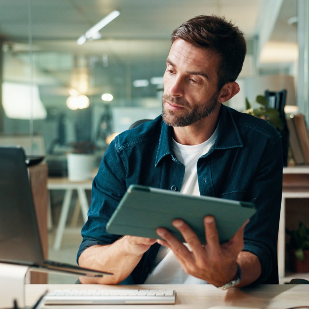 Businessman working on a laptop and tablet