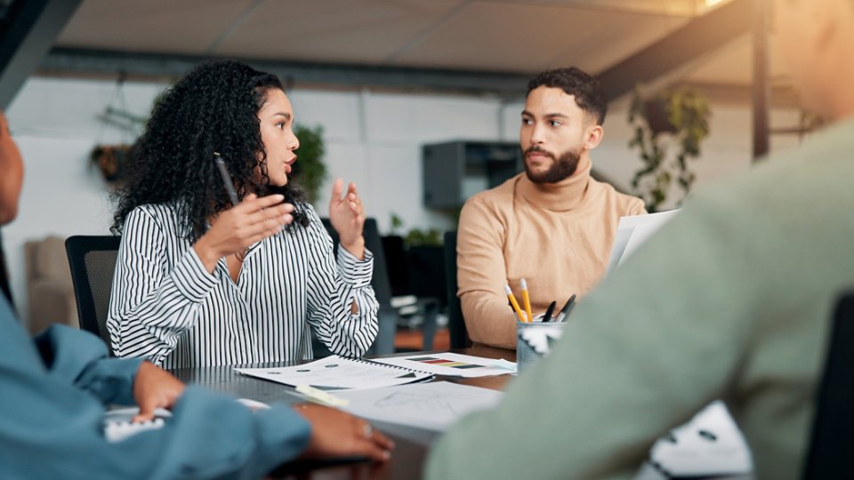 Creative, planning or designers talking in meeting for project ideas, startup or feedback. Review, interior design paperwork and people with teamwork for brainstorming, development or collaboration.