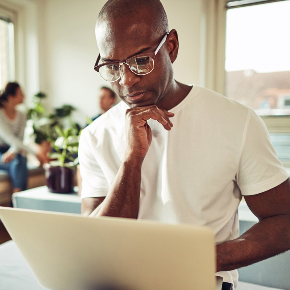 Man working on a business project on his laptop