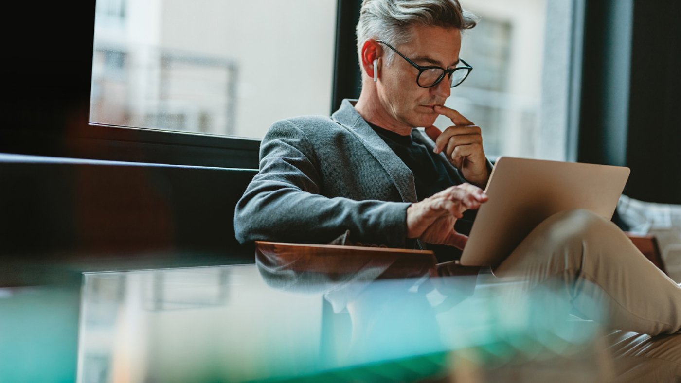 Businessman interacting with his laptop