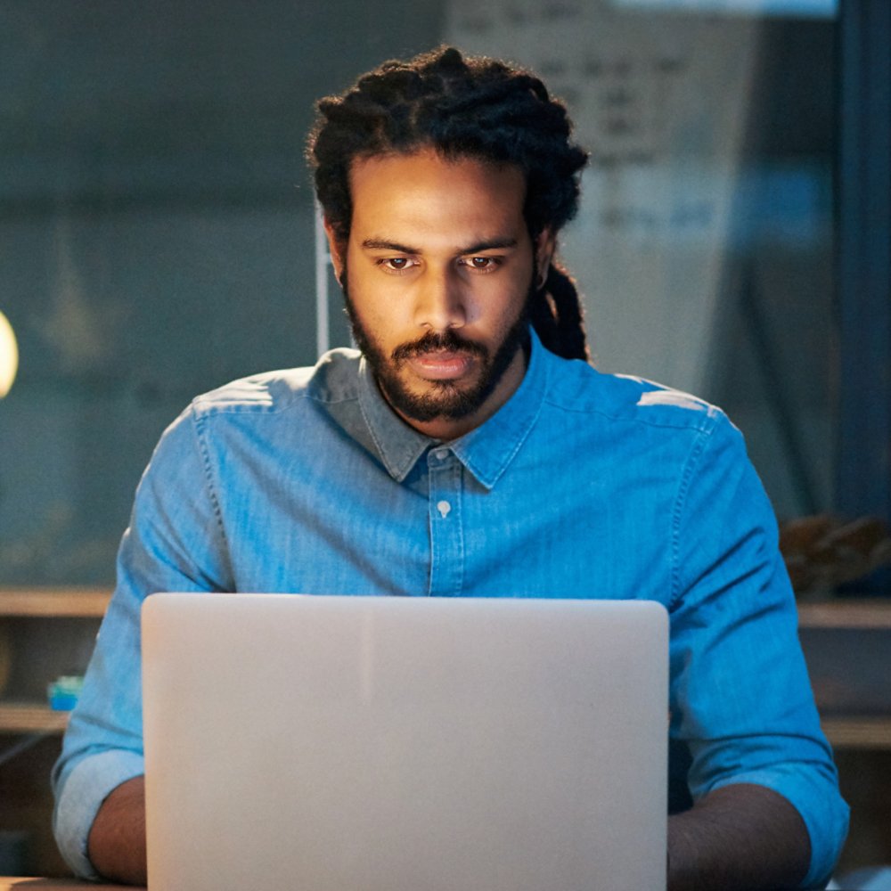 programmer working on laptop 21x9 version