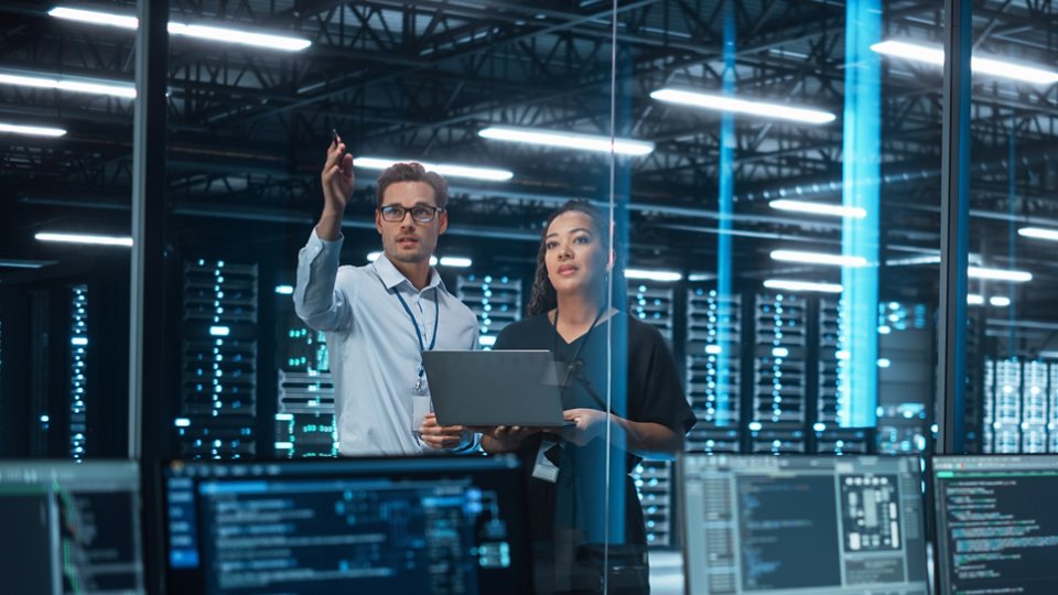 two computer engineers discussing a data server project
