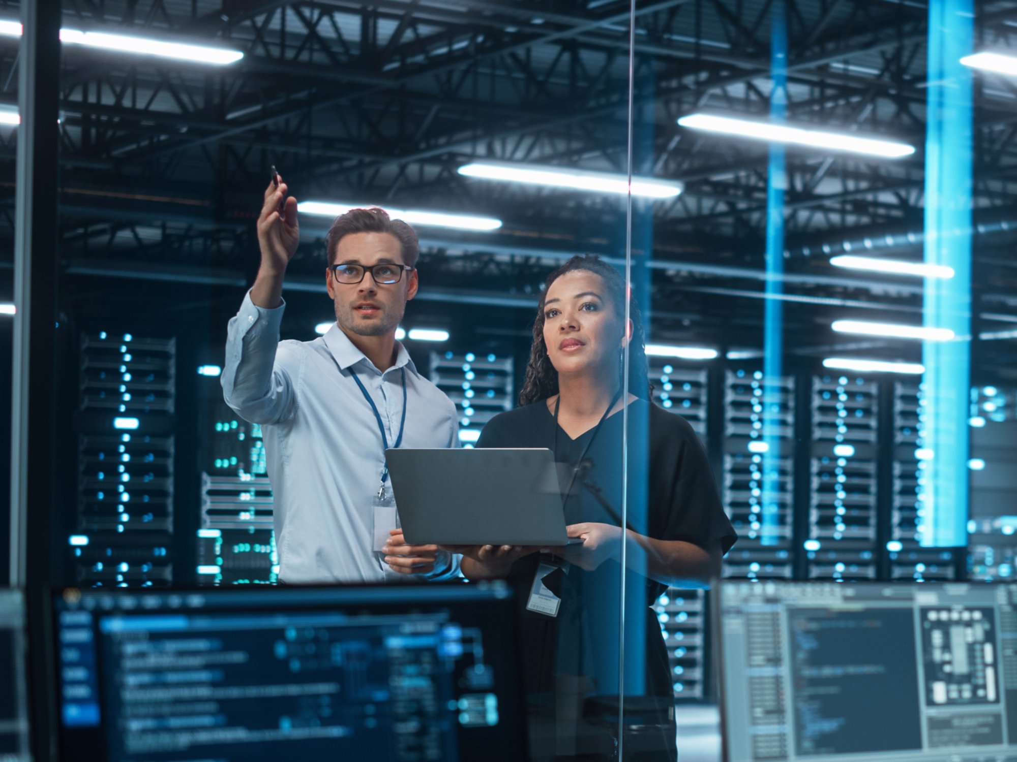 two computer engineers discussing a data server project