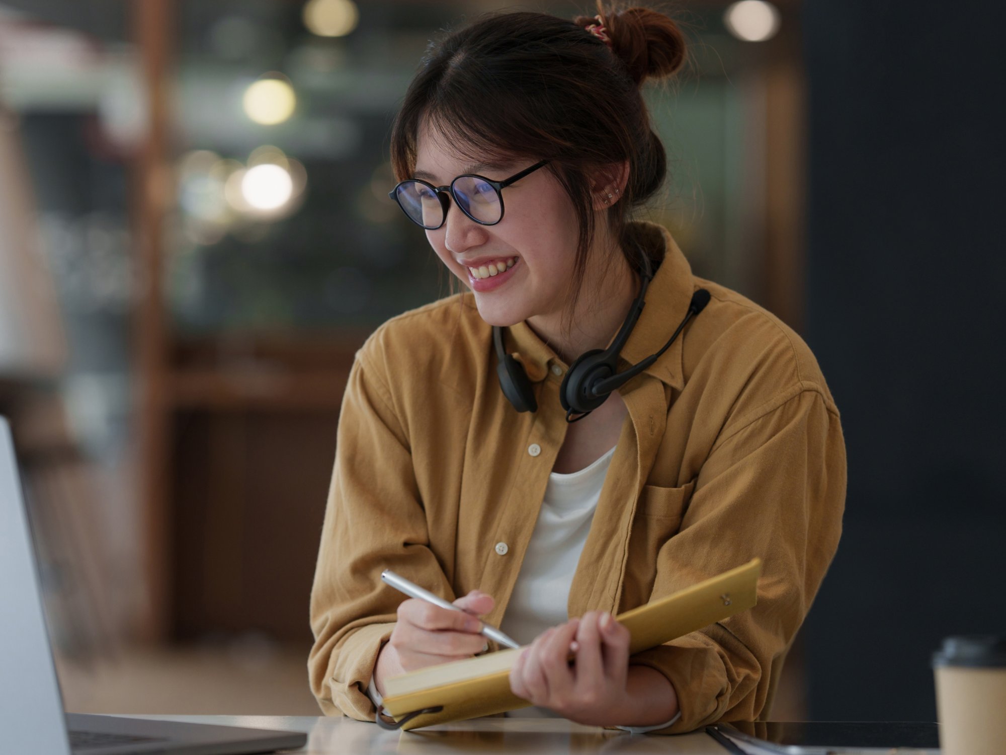 Young woman doing a school assignment on a computer