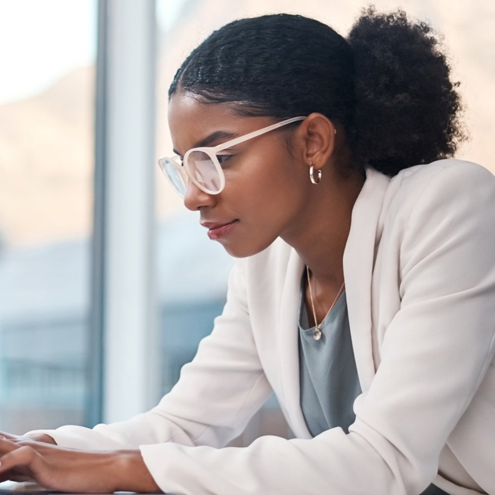Woman working diligently on her laptop