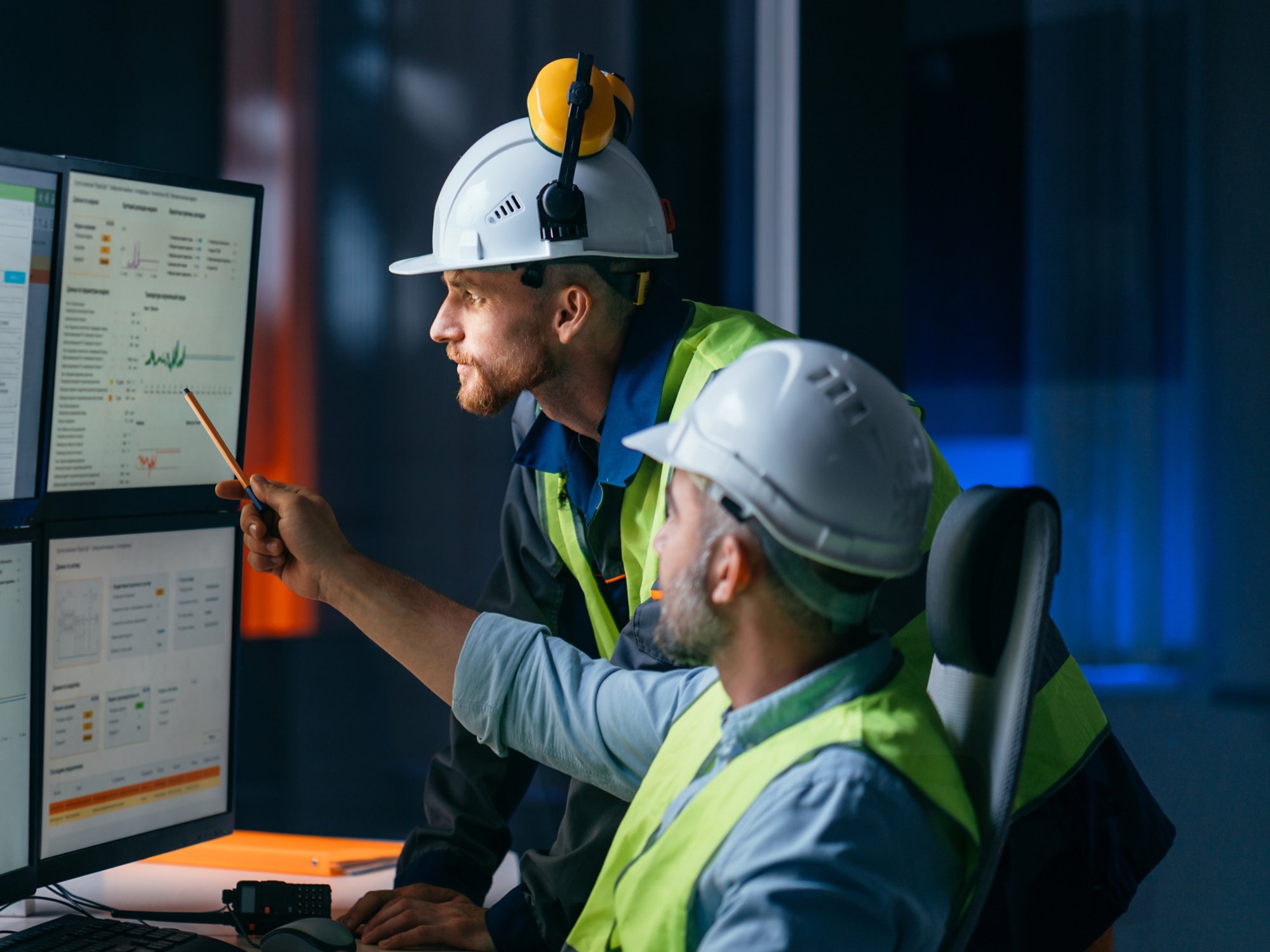 Group of operators control process on product line uses industry 4.0 and digital technology on modern factory. Two engineers follow assembly process uses SCADA system which AI technology and UI 