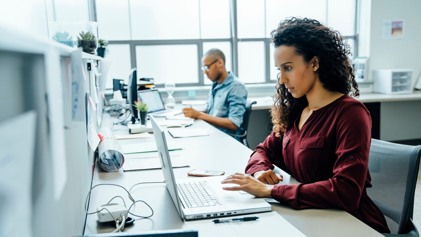 Businesswoman using laptop in office