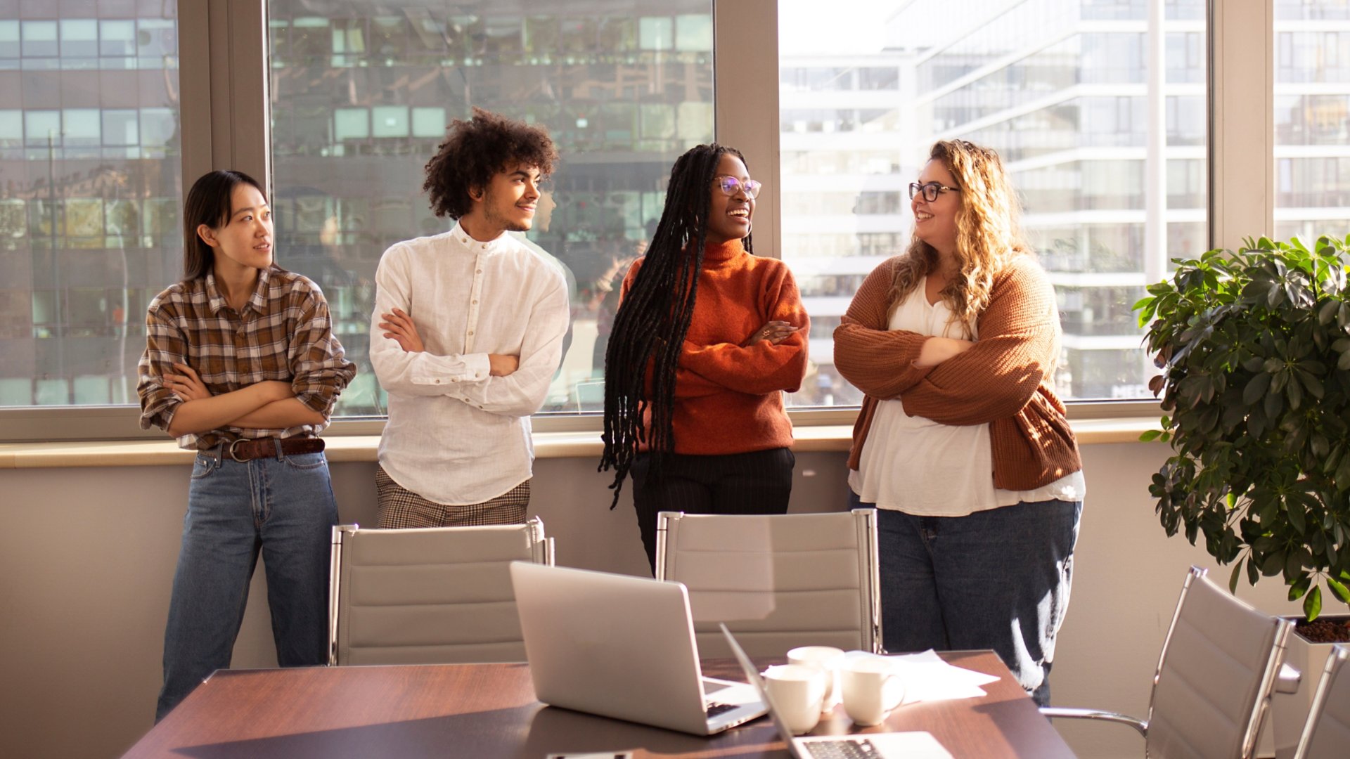 A group of young colleagues in the office are taking a break together