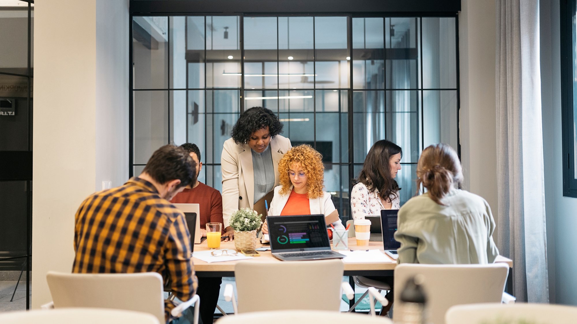 Group of multiethnic successful business people working and communicating at the office