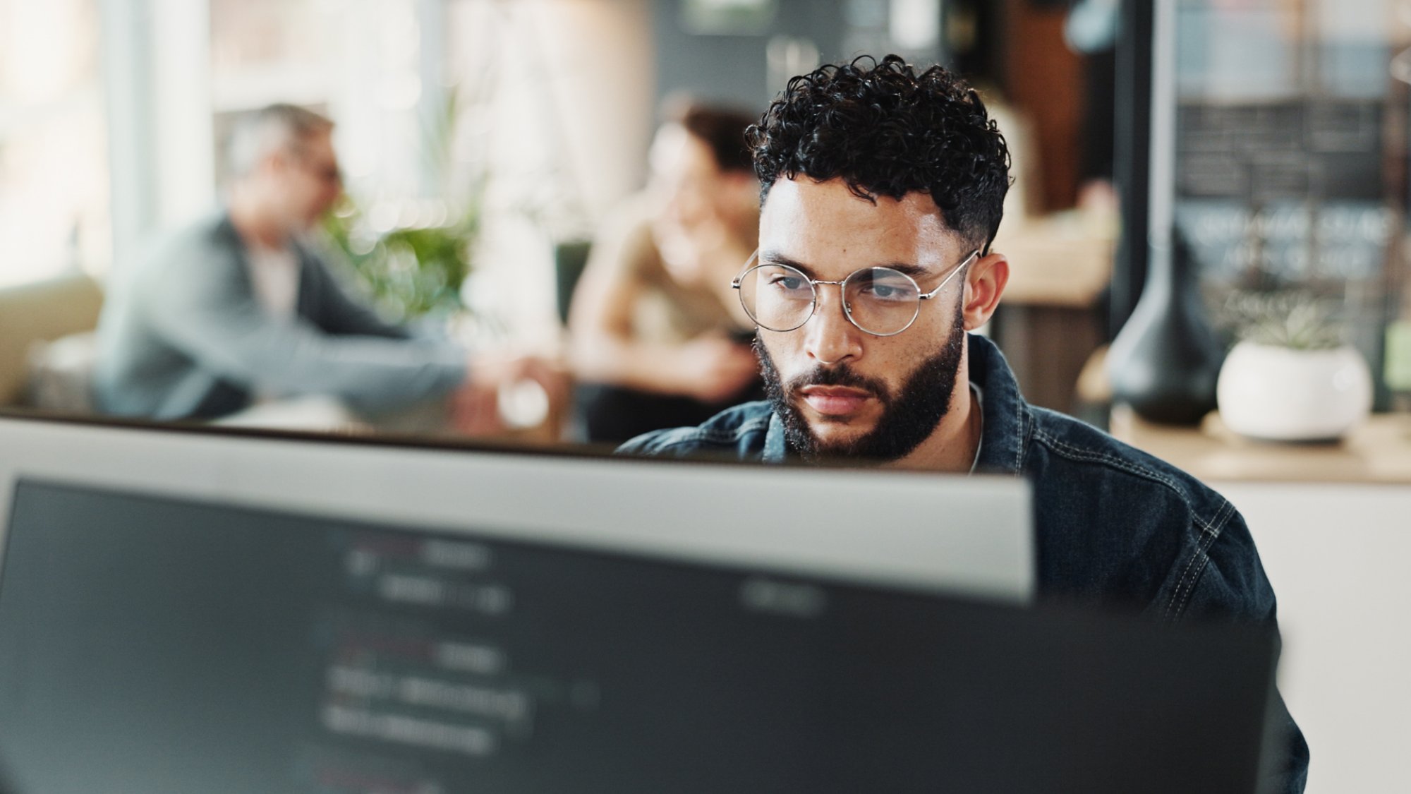 Coding, computer and web development with man in creative workplace for design or programming. Cyber security, language and system maintenance with employee person in office as website developer.